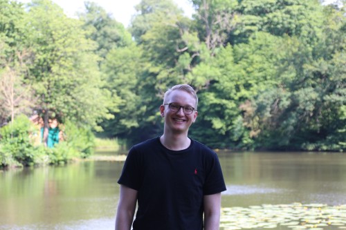 Ruben standing in front of a pond.